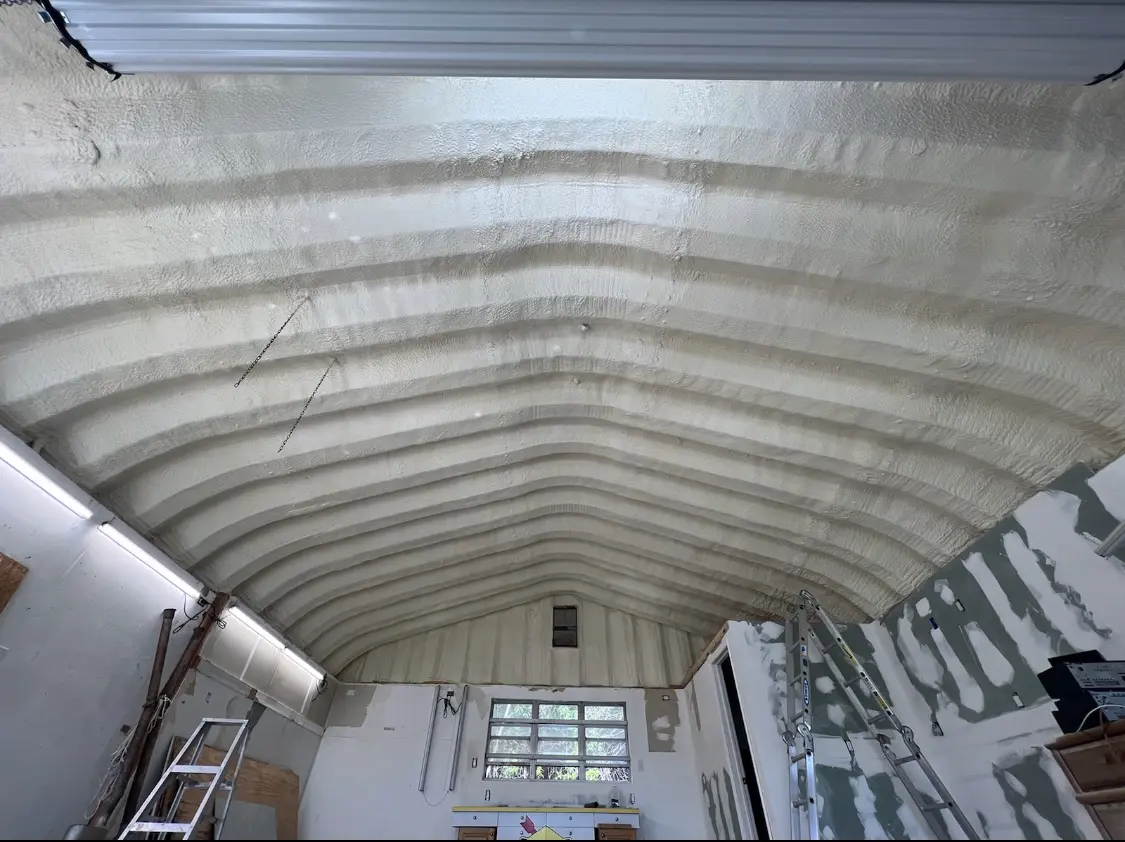 Spray polyurethane foam applied to the underside of a metal roof deck in South Kingstown
